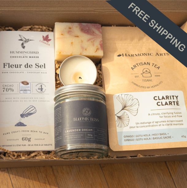 Self care subscription box Canada for wellness including chocolate, soap, shower steamers, massage candle, tea, meditation
